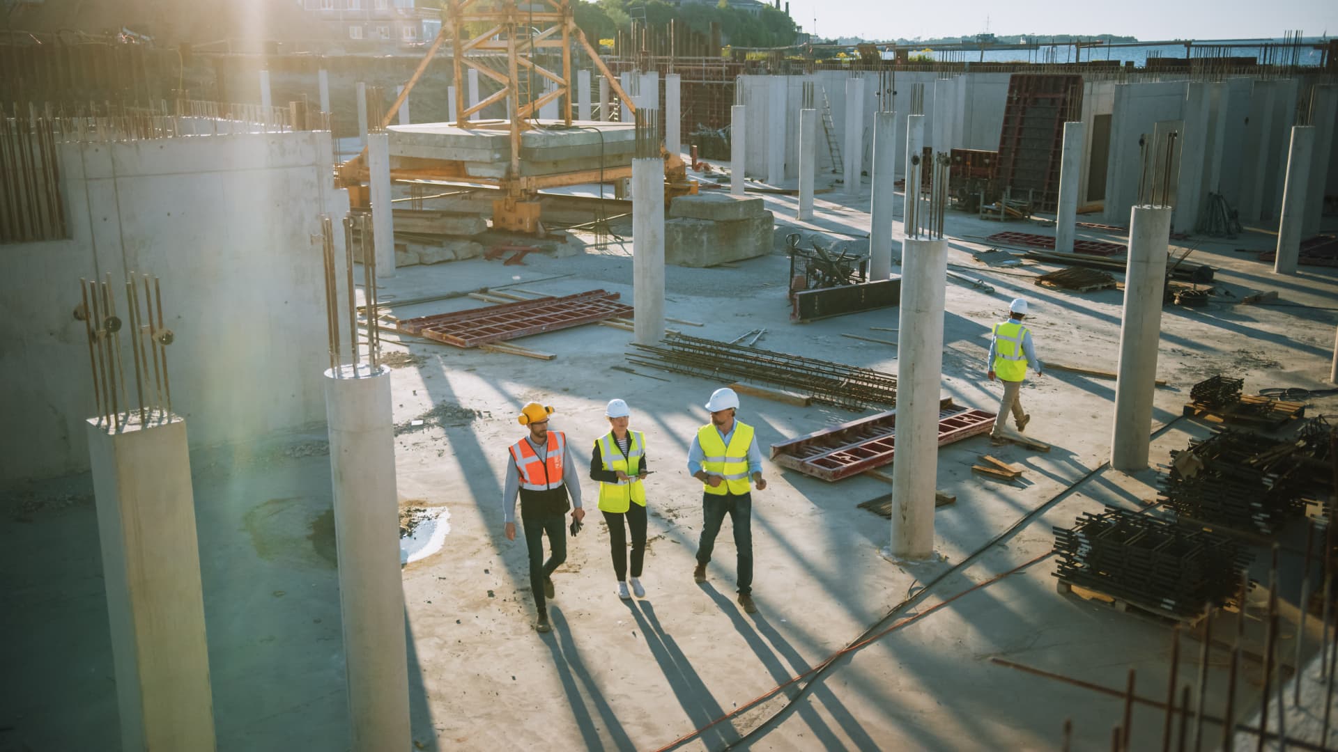 Construction professionals walking together on an active jobsite